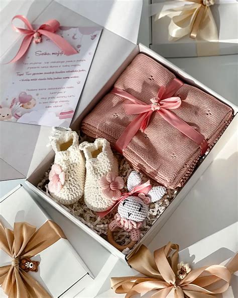 dovanų rinkinys naujagimiui su sauskelnėmis