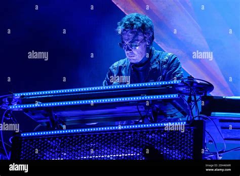 Jean-Michel Jarre performing on stage with lasers and lights
