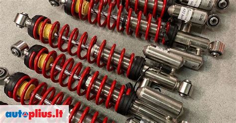 Detalė, rodanti vežimėlio amortizatorių sistemą