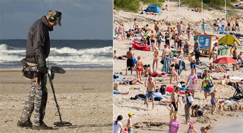 vaikas su metalo detektoriumi tyrinėja smėlį paplūdimyje