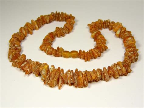 gintaro karoliai kūdikiui