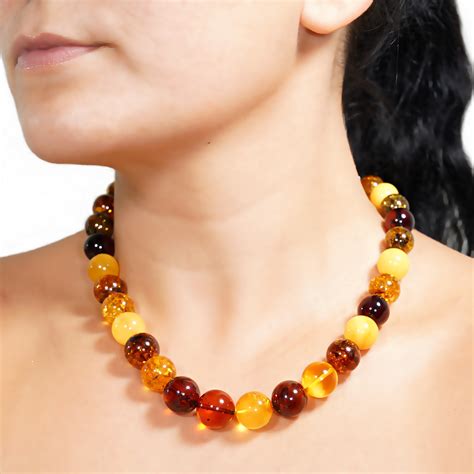 gintaro papuošalai moterims