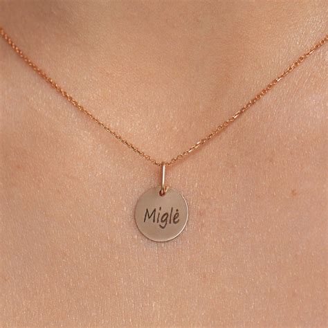 auksinis pakabukas su inicialais